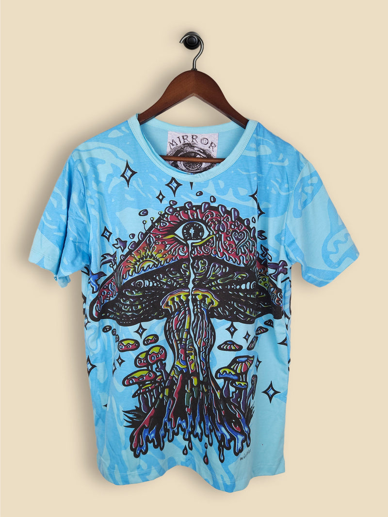 A blue T-shirt featuring a colourful, psychedelic mushroom design with smaller mushrooms, vibrant colors and star-like shapes.