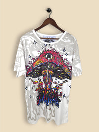 A white T-shirt featuring a colourful, psychedelic mushroom design with smaller mushrooms, vibrant colours and star-like shapes.
