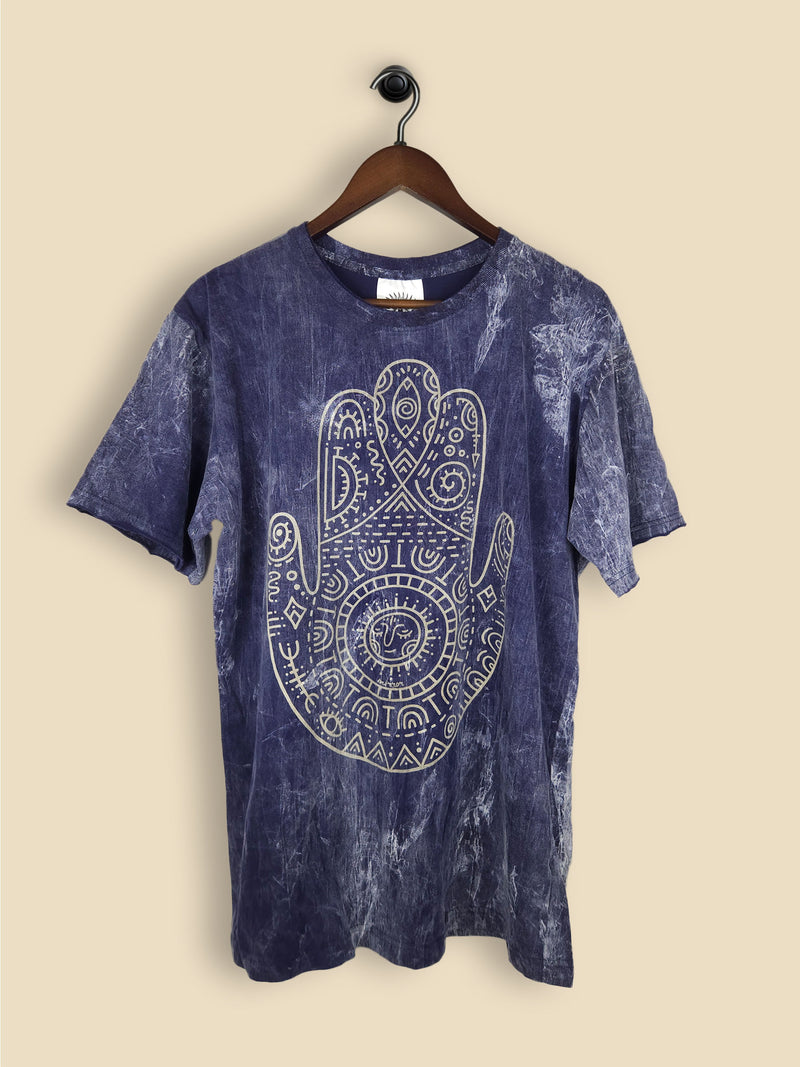 A dark blue t-shirt featuring a print of a hamsa hand with geometric patterning