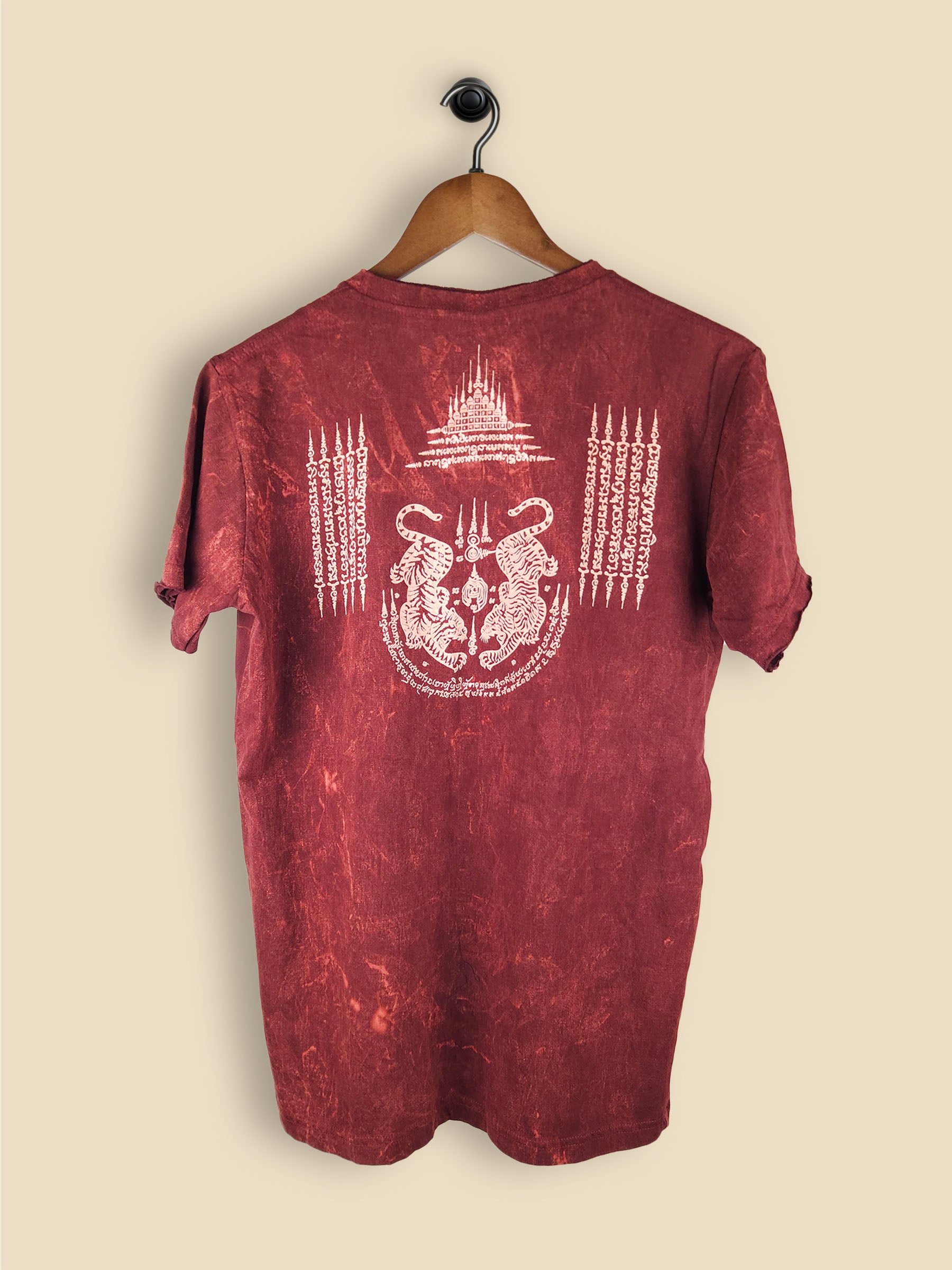 Maroon t-shirt with a mirrored white tiger graphic and abstract tribal symbols