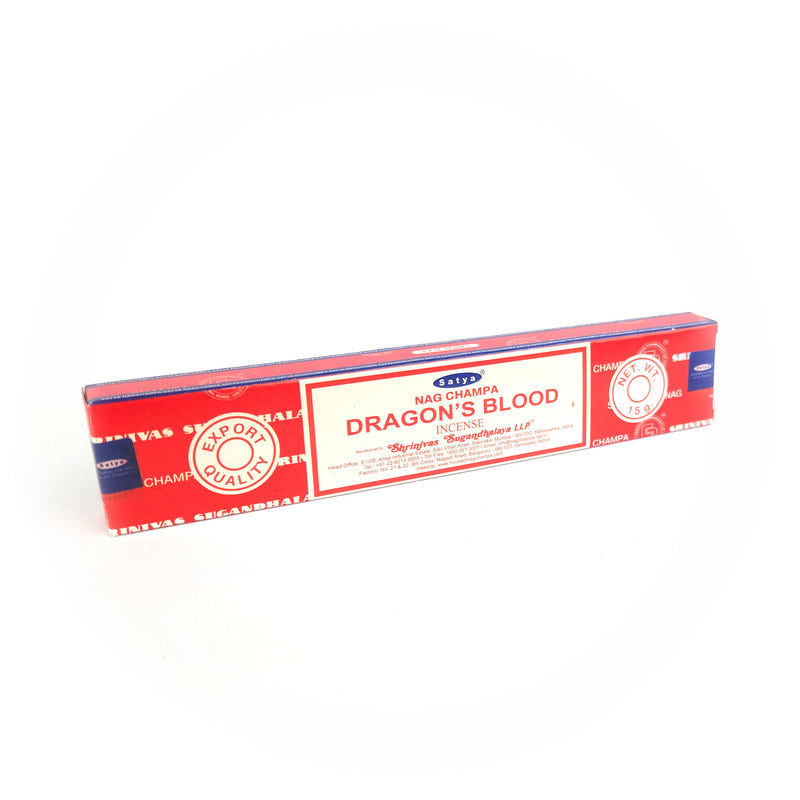 Alt text: A rectangular box of Satya Dragon’s Blood incense sticks with a vibrant red design, accented with blue and white text. The label prominently reads 'Satya Dragon’s Blood Agarbatti,' and features details like 'Shrinivas Sugandhalaya LLP,' 'Export Quality,' and 'Net Wt. 15g.'