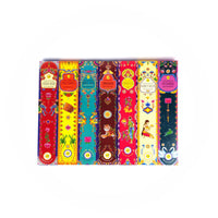 A colourful display of seven incense stick packages, each with unique designs and labels. The packages are labelled as follows from left to right: Sandalwood, Palo Santo, White Sage, Cinnamon, Frankincense, Amber Musk, and Patchouli. Each package features vibrant illustrations and patterns, including flowers, animals, and traditional motifs.