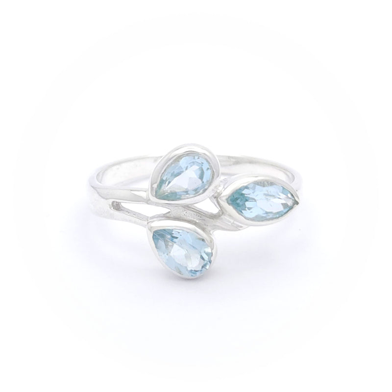 A blue topaz ring with a vibrant, azure gemstone set in a finely crafted silver band, sparkling elegantly.