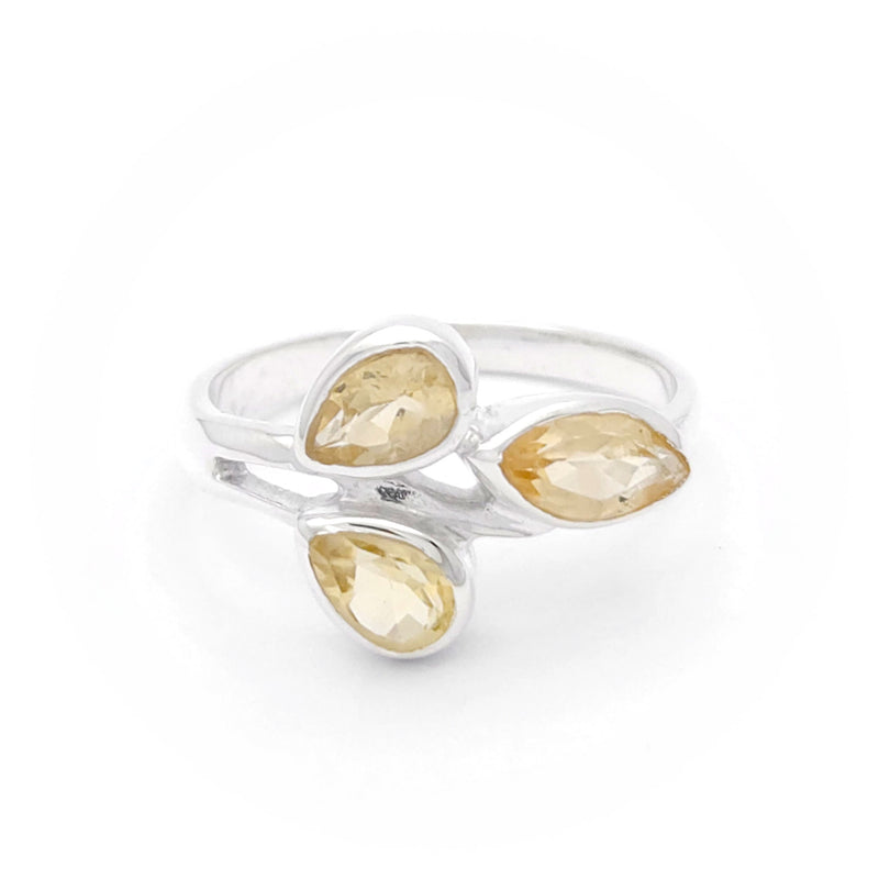 A citrine ring featuring a glowing golden gemstone set in an elegant, polished band.