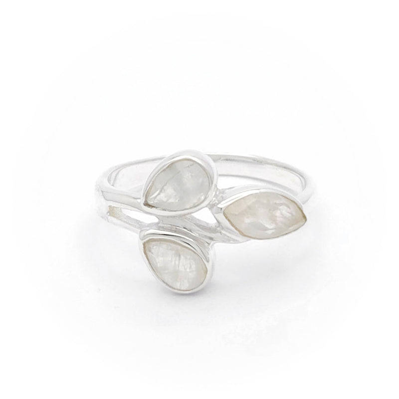 The image shows a silver ring with three pear-shaped, moonstone gemstones. The gemstones are arranged in a cluster design, giving the ring an elegant and unique appearance. This type of jewellery is interesting and relevant for those looking for distinctive and stylish accessories.