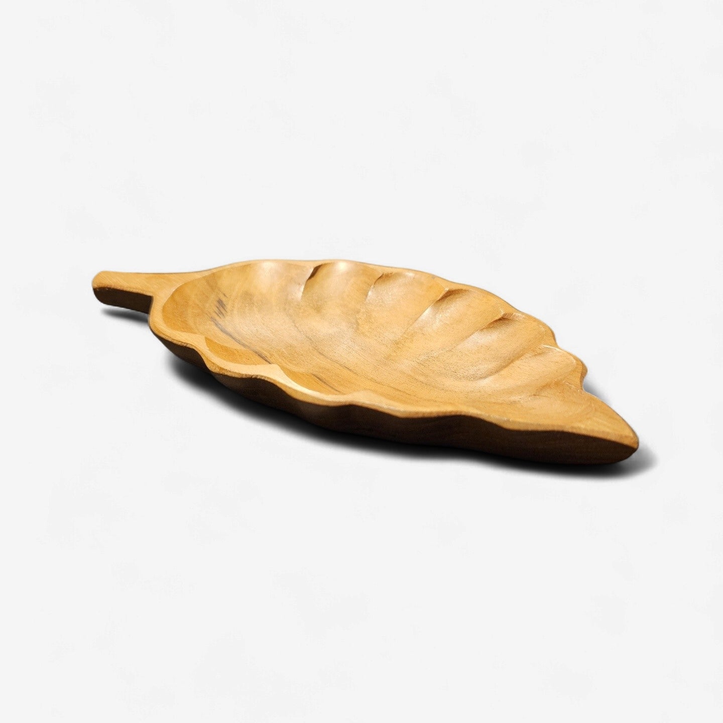 Wooden leaf-shaped tray on a white background