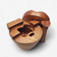 Wooden hedgehog figurine on a white background